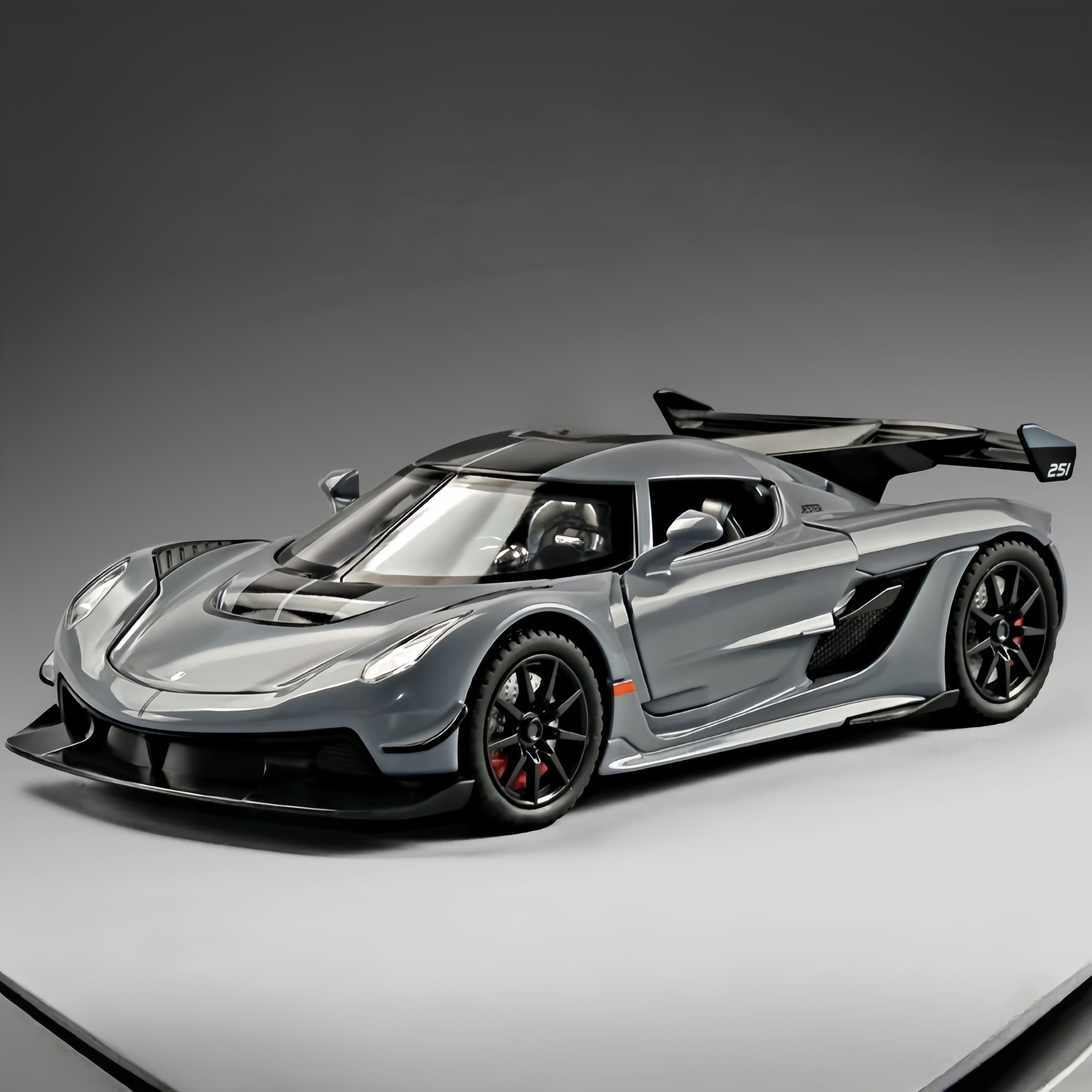 Koenigsegg Jesko Attack 1:24 Diecast Model - Opening Dihedral Syncro Helix Doors, Active Rear Wing, Detailed V8 Engine & Aero Carbon Wheels